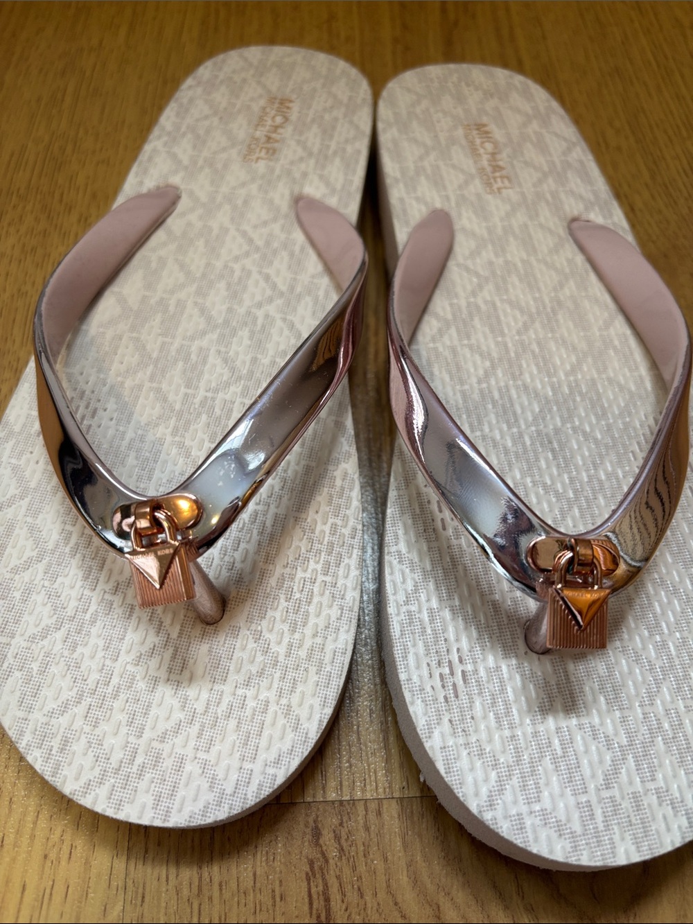 Michael Kors rose gold flip-flops